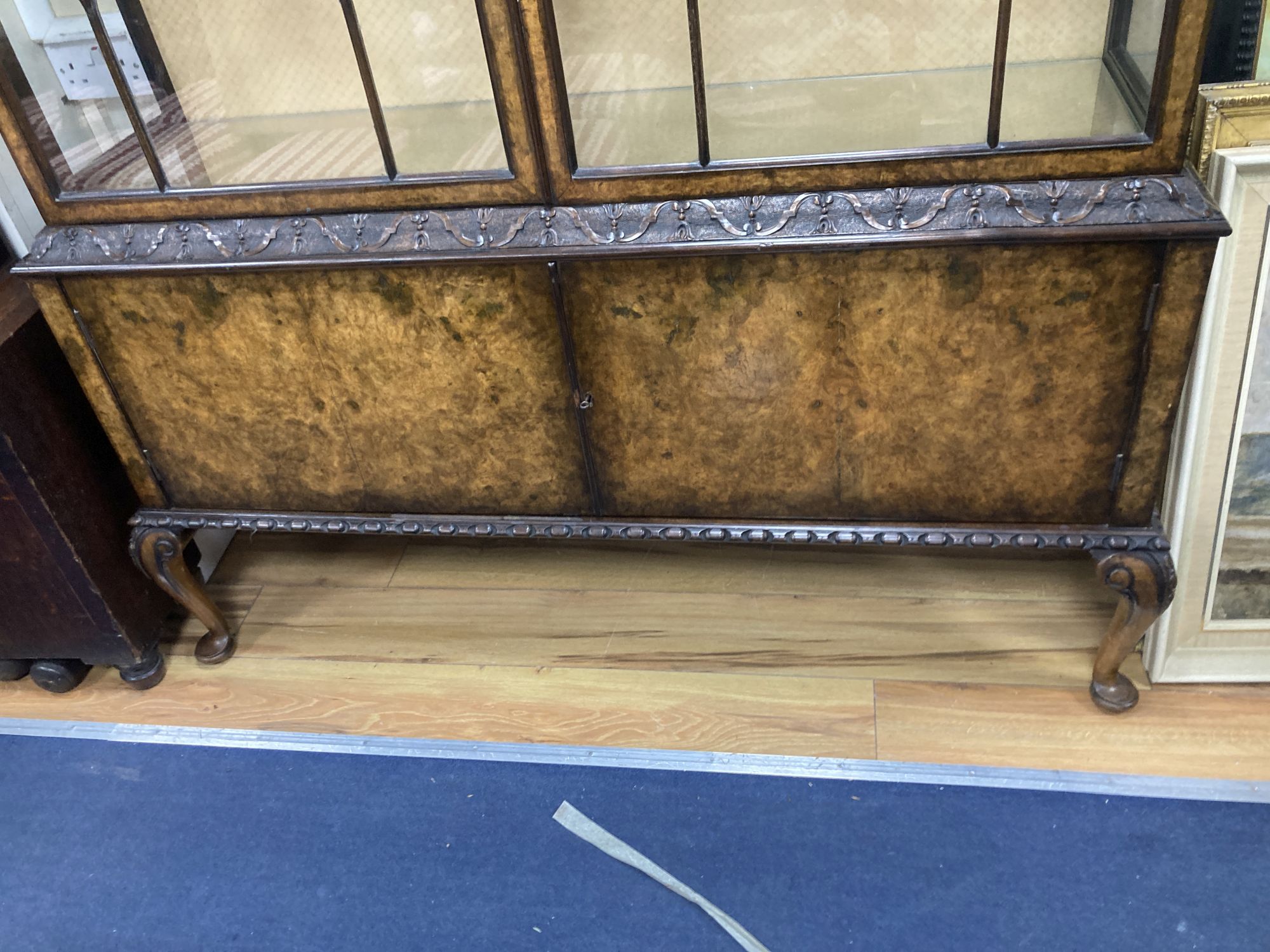 A Queen Anne revival burr walnut glazed china display cabinet, combined cupboard, length 136cm, depth 40cm, height 184cm